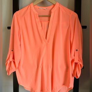 Peachy hi-lo shirt. Beautiful blouse.